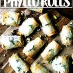 Salami and provolone phyllo rolls on a board.