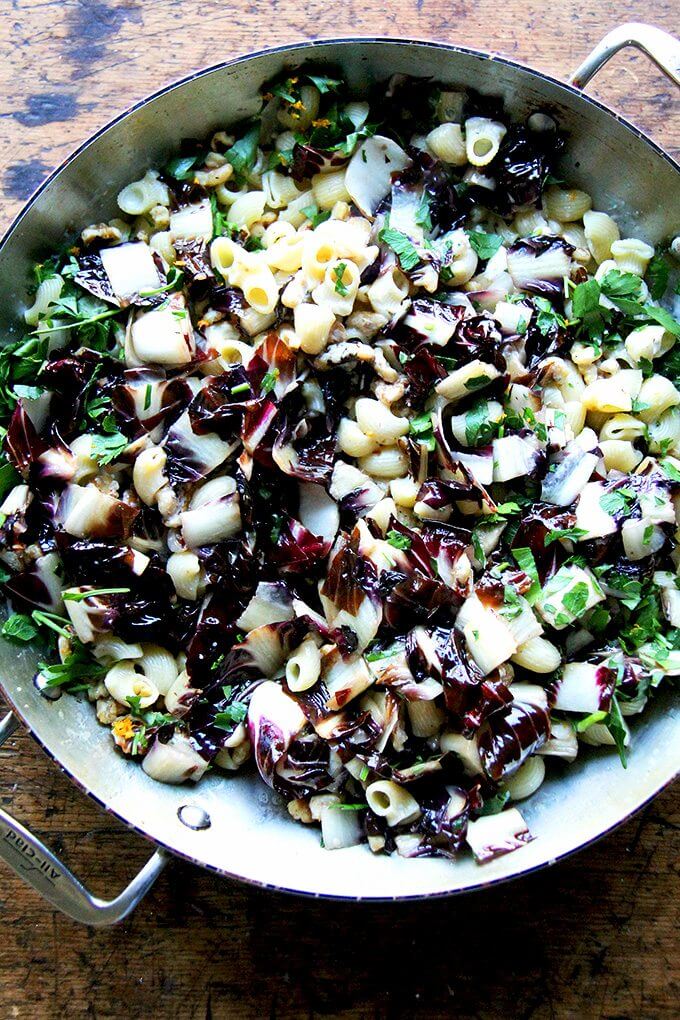 In less than 10 minutes, this radicchio pasta enters the pan, the silky sauce enveloping it along with the walnuts, parsley, and orange zest. Lots of fresh cracked pepper and shavings of Pecorino at the table completed the dish. // alexandracooks.com In less than 10 minutes, this radicchio pasta enters the pan, the silky sauce enveloping it along with the walnuts, parsley, and orange zest. Lots of fresh cracked pepper and shavings of Pecorino at the table completed the dish. // alexandracooks.com