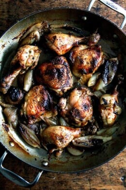 A pan of roast chicken and shallots.