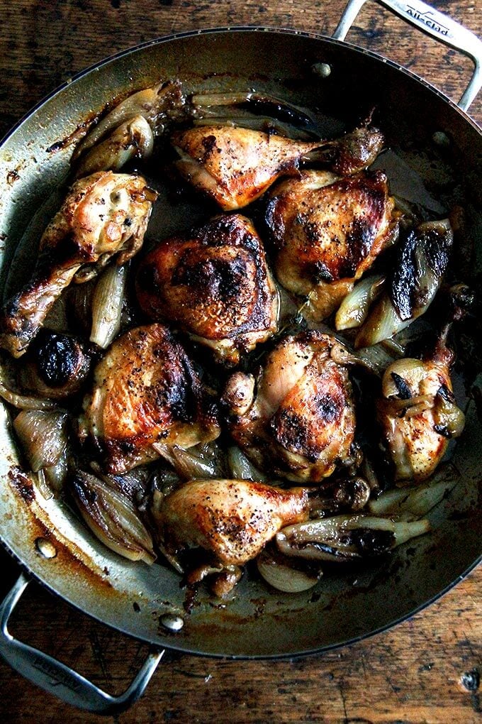 A pan of roast chicken and shallots.