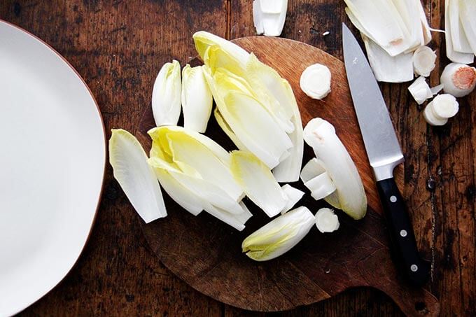 A board of endive separated into leaves.