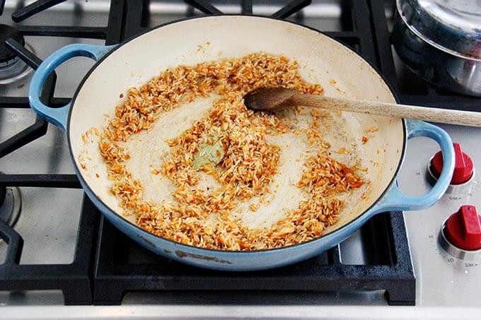 A skillet with Moroccan rice in the making.