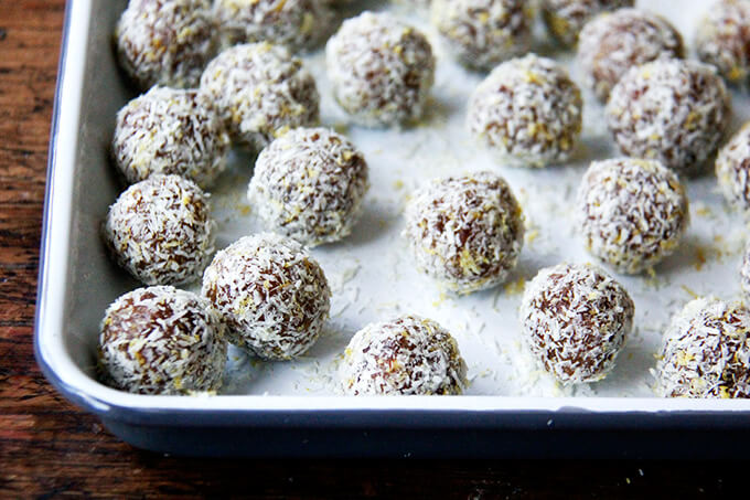 A tray of lemon coconut date balls.