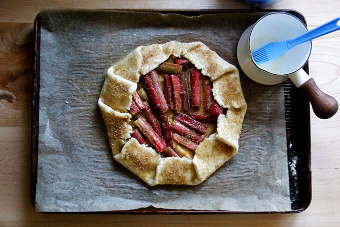 Galette on a sheet pan, brushed with egg wash, sprinkled with sugar.