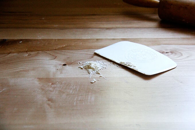 A bench scraper on a counter.