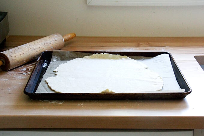 Foolproof food processor pastry dough on a sheet pan lined with parchment paper.