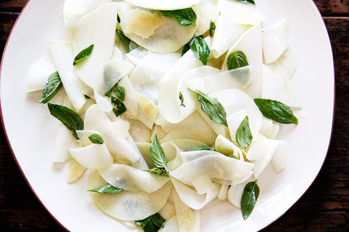 Kohlrabi Salad with basil and parmesan on a platter.