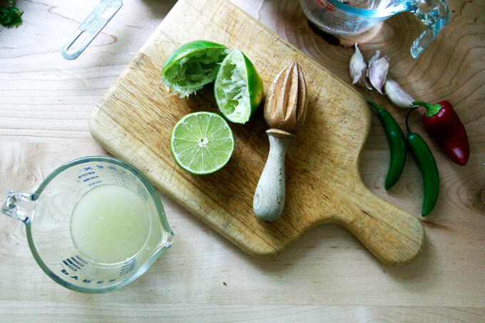 A liquid measure filled with fresh lime juice.