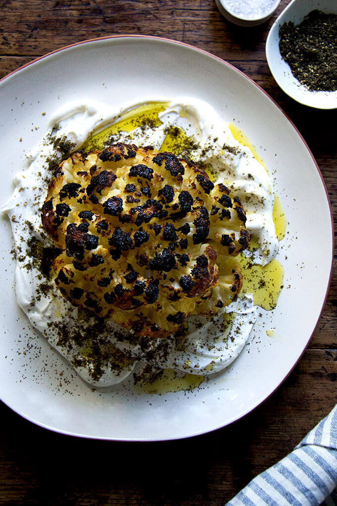 Whole roasted cauliflower with yogurt sauce.
