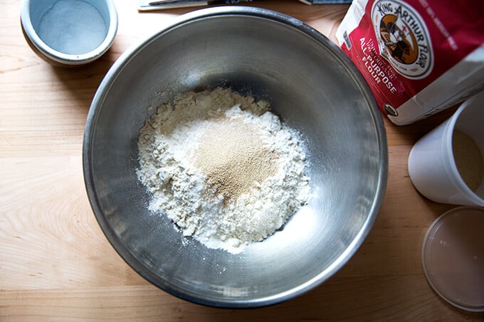 A bowl with flour, salt, and yeast.