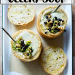 An overhead shot of a bowl of cream of celery soup.