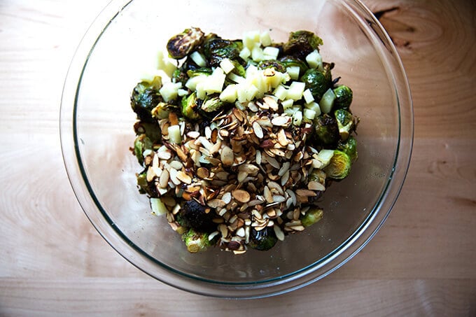 A bowl of roasted Brussels sprouts, almonds, Manchego.