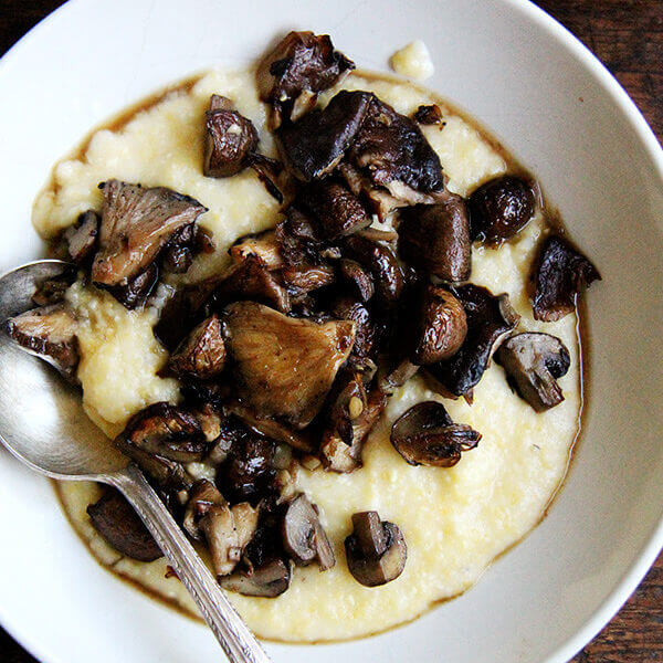 A bowl of oven-baked polenta and mushrooms.