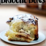 A brioche cinnamon bun, frosted.
