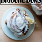 A brioche cinnamon bun, frosted.