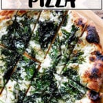 Kale pizza on a pizza peel.