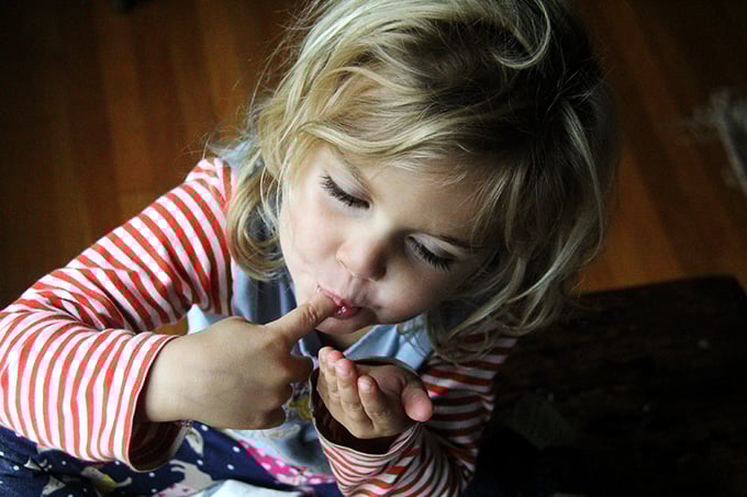 Wren, licking her fingers.