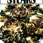 Cauliflower steaks with caper-walnut salsa on a platter.
