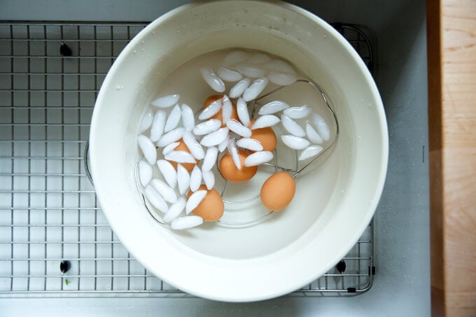 An ice bath with the just-cooked Instant Pot hard-boiled eggs inserted into.
