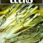 A skillet holding braised leeks.