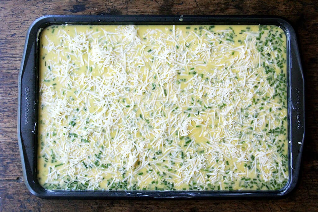 Eggs on a sheet pan ready for the oven.