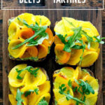 A board with beet and avocado tartines.