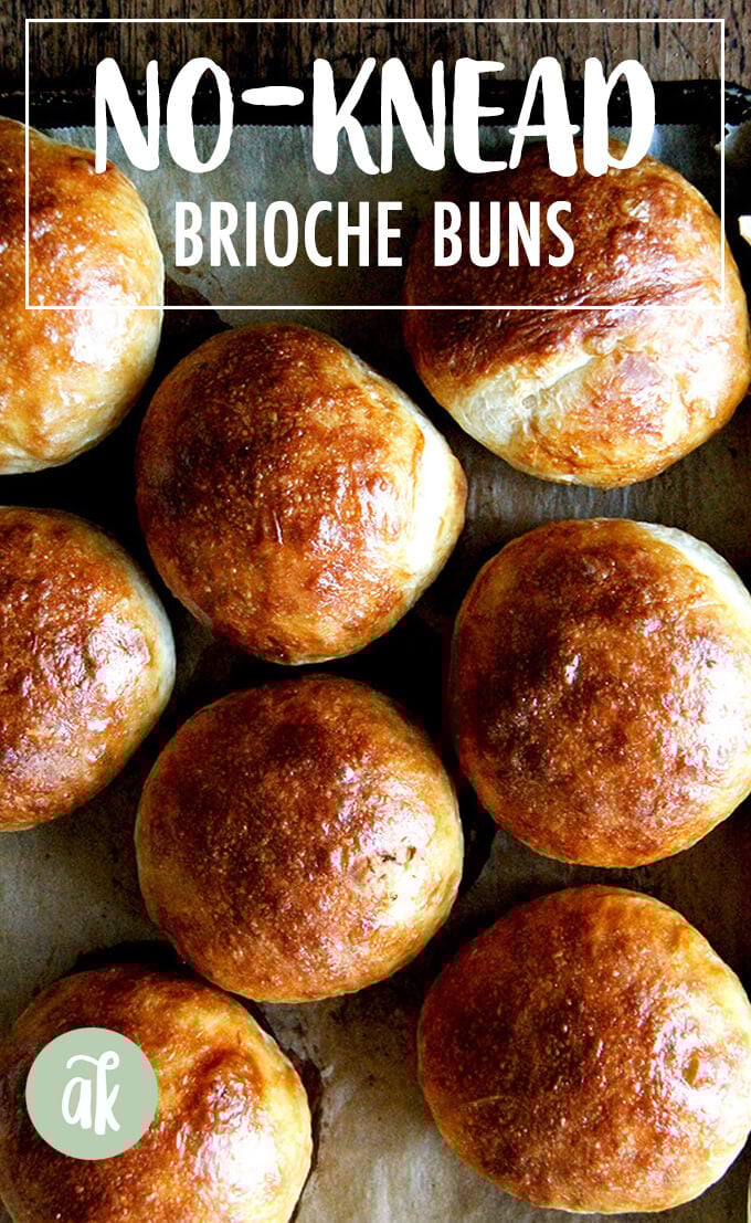 A sheetpan of just-baked brioche buns.