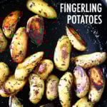 A cast iron skillet filled with crispy fingerling potatoes.