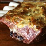 A board with rack of lamb resting on it.