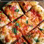 A margherita pizza baked on the Baking Steel cut into pieces.