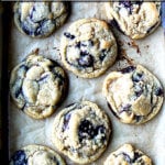 A sheet pan of freshly baked chocolate chip cookies.