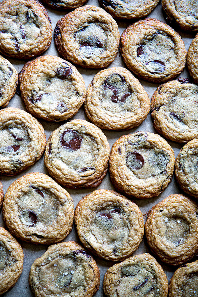 Gluten-free chocolate chip cookies on a sheet pan.