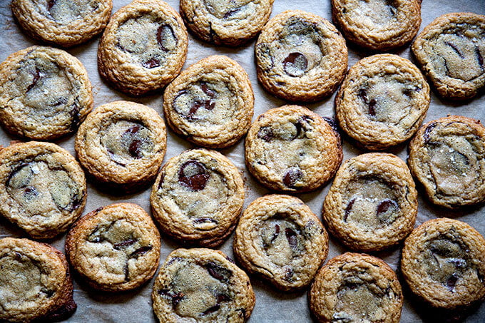Gluten-free chocolate chip cookies on a sheet pan.