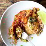 A bowl of chicken enchilada casserole.