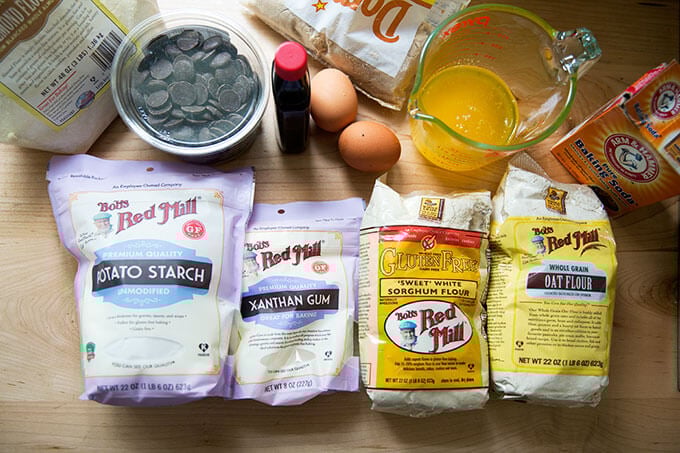 All of the ingredients for gluten-free chocolate chip cookies on a countertop.