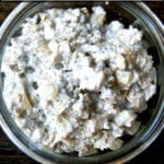 A bowl of overnight oats spiced with cinnamon, apples and maple.