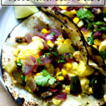 Egg tacos withBreakfast tacos with Caramelo tortillas and roasted corn and poblano salsa.