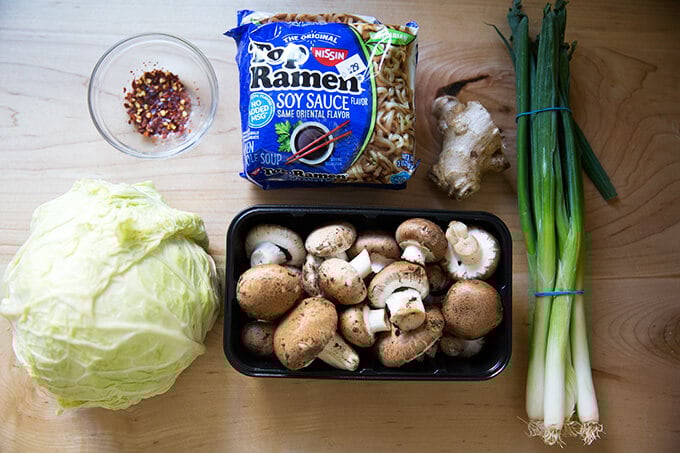 An overhead shot of the ingredients to make one-pot ginger-scallion ramen noodles.