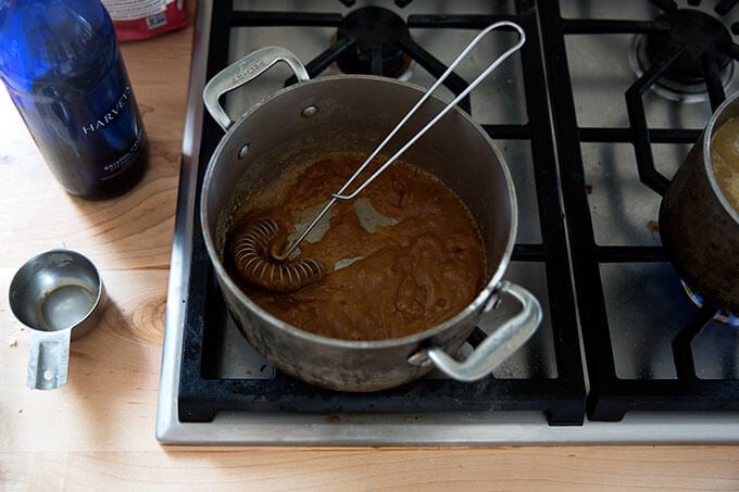 A saucepan filled with a roux and Sherry mixed together.