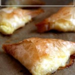 A sheet pan with just-roasted tiropitas.