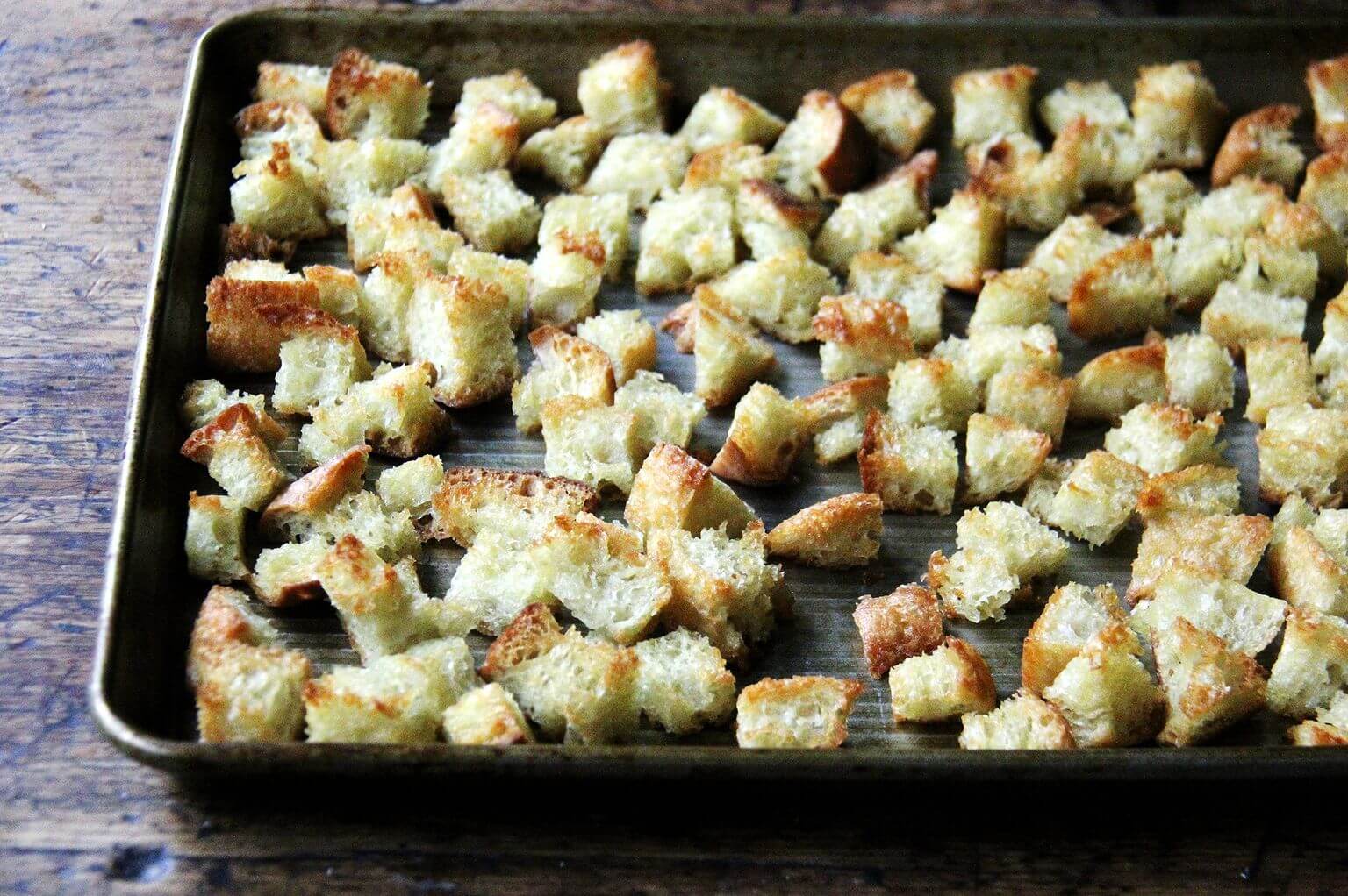 a sheet pan of cubed toasted peasant bread