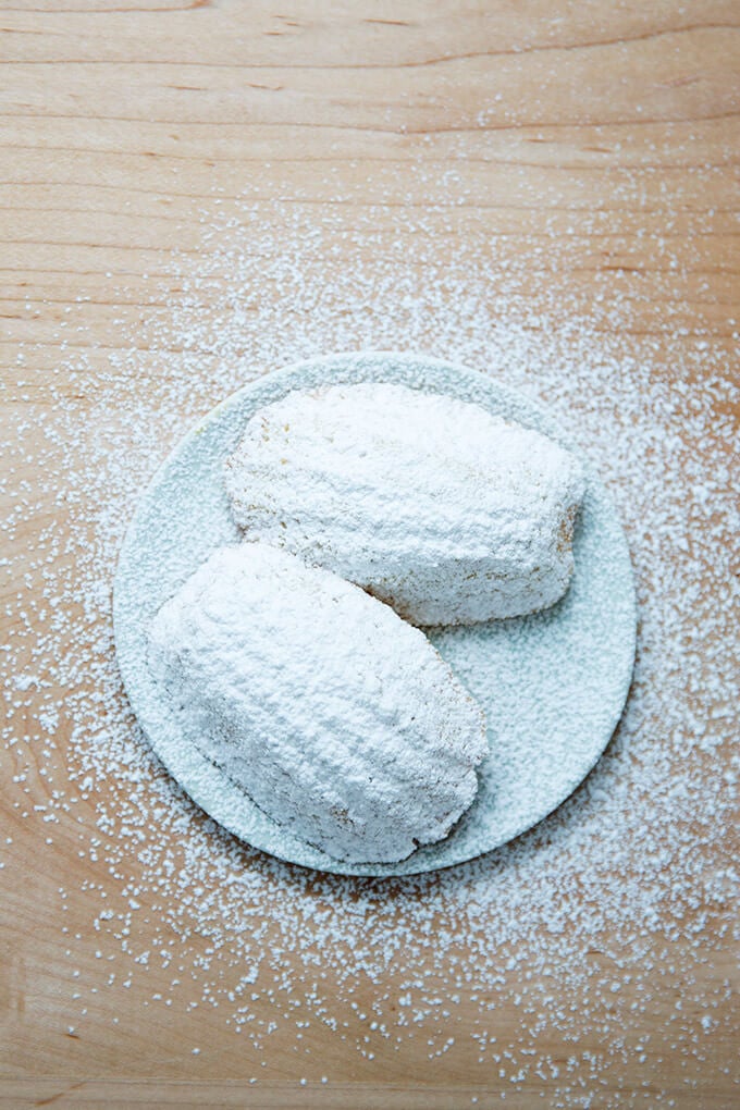 two lemon madeleines on a plate