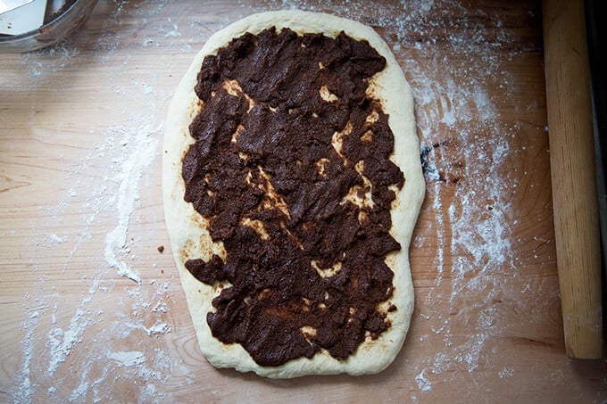 Rolled out brioche dough spread with brown sugar mixture.
