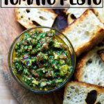 An overhead shot of a bowl holding sun dried-tomato pesto.