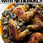 A platter of roast chicken with dates and artichoke hearts.