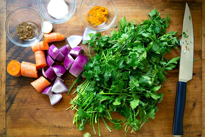 Ingredients for falafel burger on a cutting board.