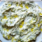 A platter smeared with tzatziki.