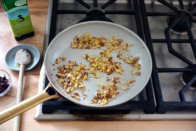 Toasty bread crumbs in a skillet.