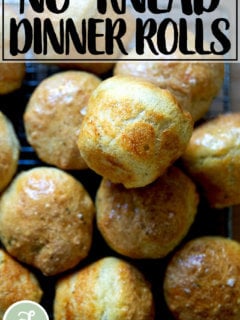 Thyme dinner rolls on a cooling rack.