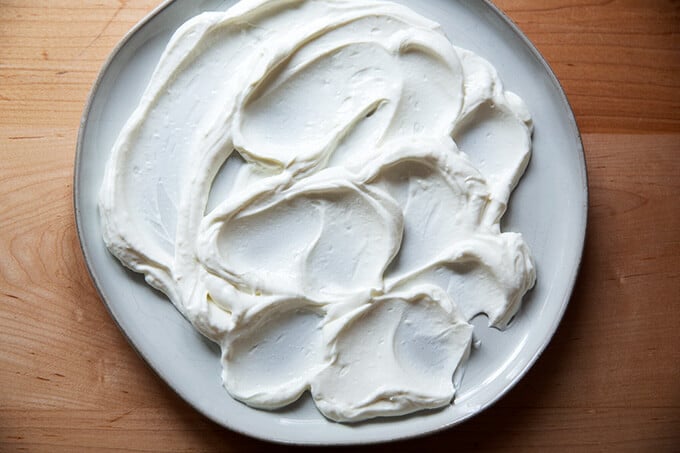 A plate smeared with lemony yogurt sauce.